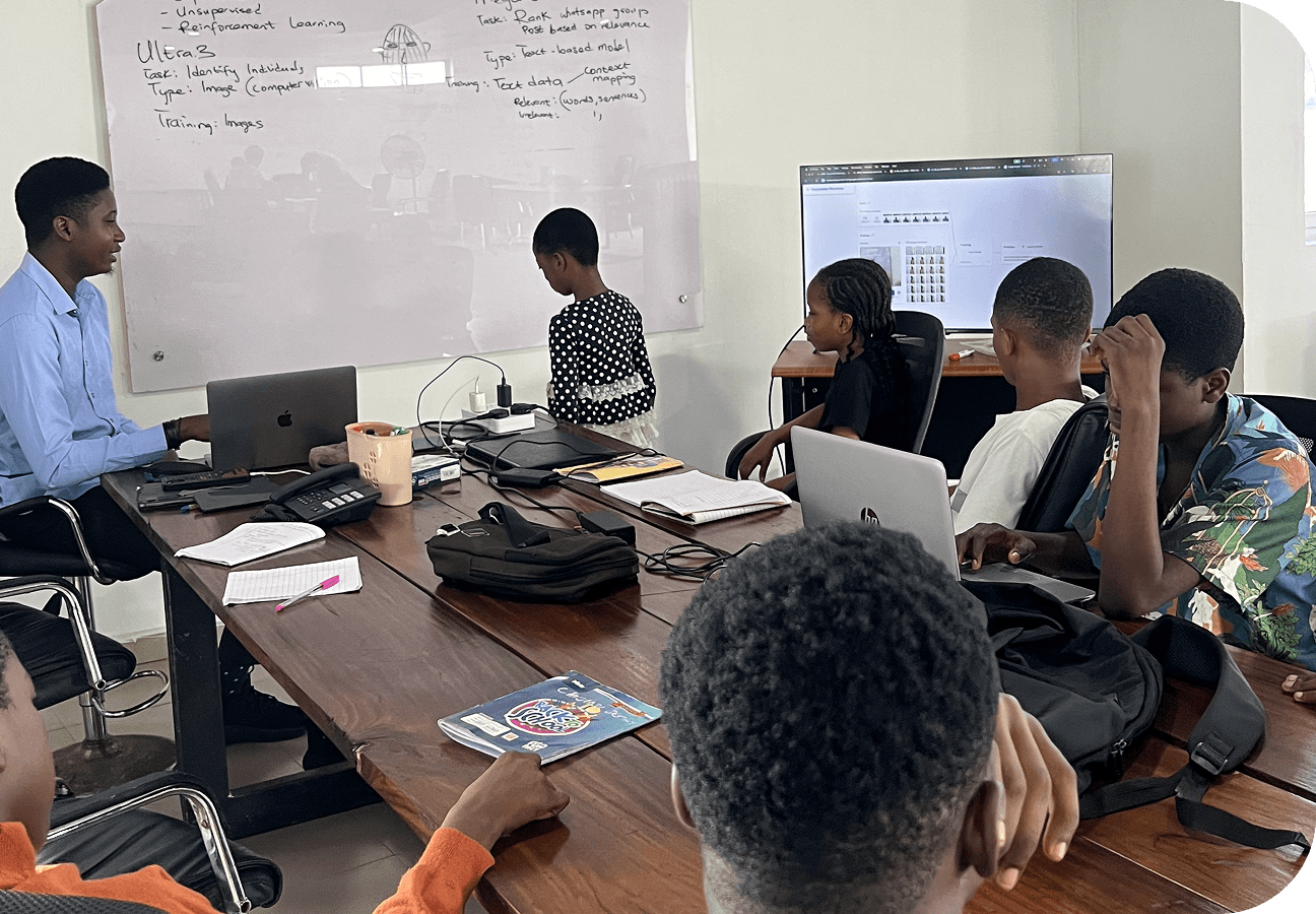 Kids coding on laptops